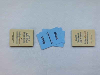 Level 3 sight word slap it game with two piles of tan cards face down and a discard pile in the middle