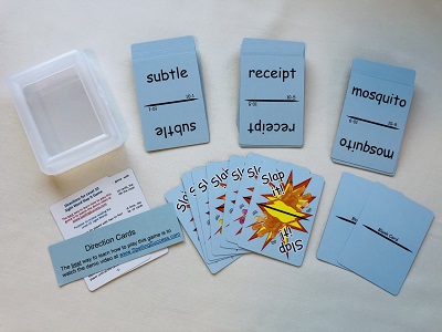 a plastic case next to 3 blue sight word cards which are above direction cards and slap it cards